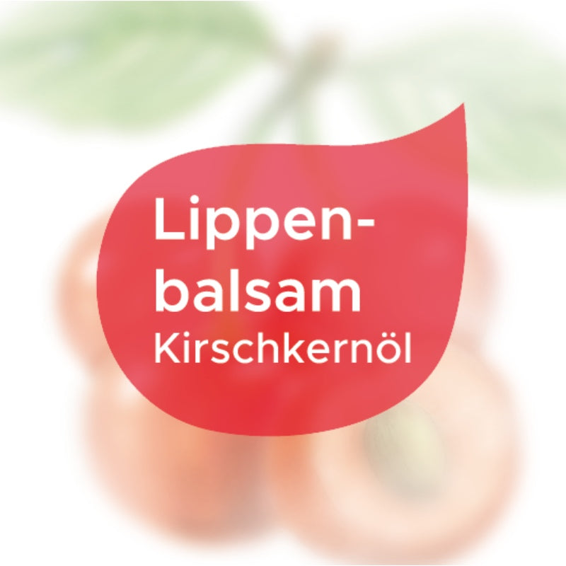 Etikett Lippenbalsam Kirschkernöl als roter Tropfen auf weißen Hintergrund
