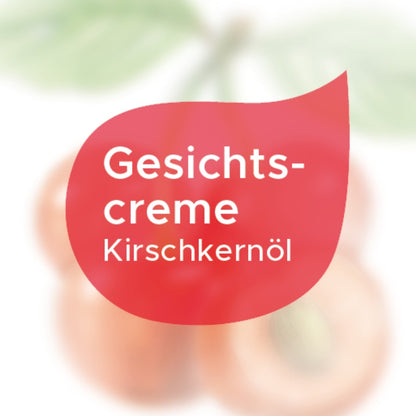 Etikett Gesichtscreme mit Kirschkernöl in einem roten Tropfen auf weißem Hintergrund
