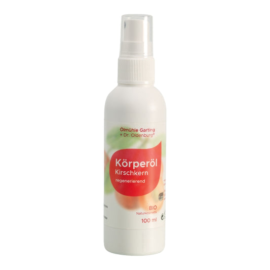 Bio Körperöl mit Kirschkernöl von Dr. Oldenburg und Ölmühle Garting in 100 ml Flasche mit weißem Pumpverschluss auf weißem Hintergrund