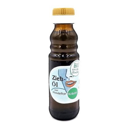 Bio Ziehöl Kräuter zur Mundpflege, 100 ml in brauner Glasflasche der Ölmühle Garting mit blauem Etikett auf weißem Hintergrund